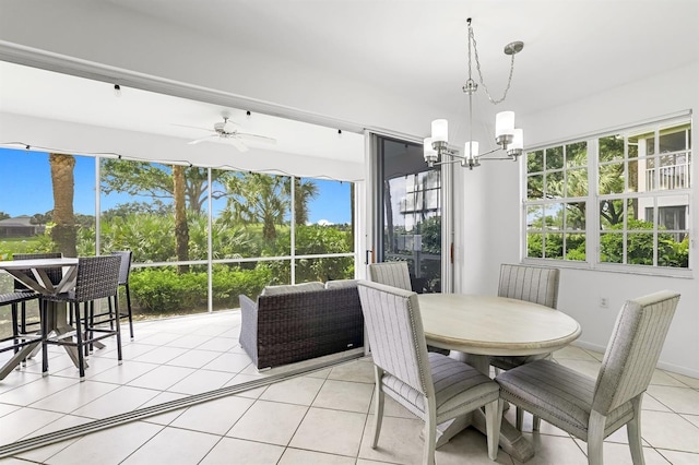 sunroom / solarium with ceiling fan with notable chandelier