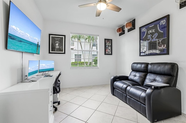 office featuring light tile patterned flooring and ceiling fan