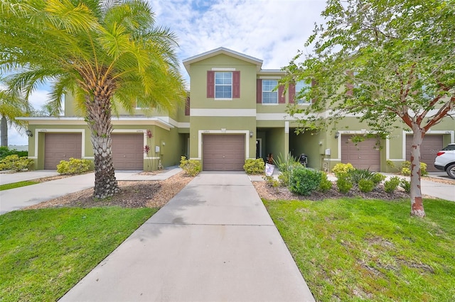 townhome / multi-family property featuring a garage