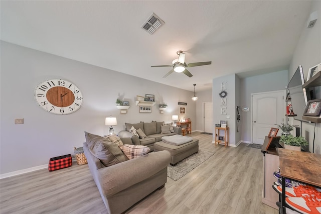 living room featuring light wood-type flooring and ceiling fan