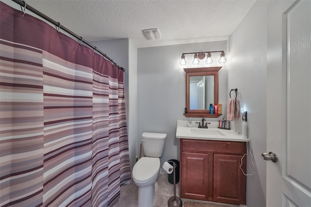 bathroom with vanity, walk in shower, a textured ceiling, and toilet