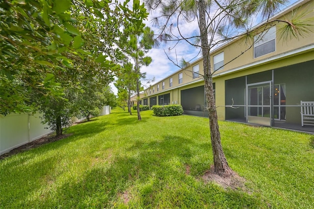 view of yard with a sunroom