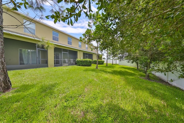 view of yard with a sunroom