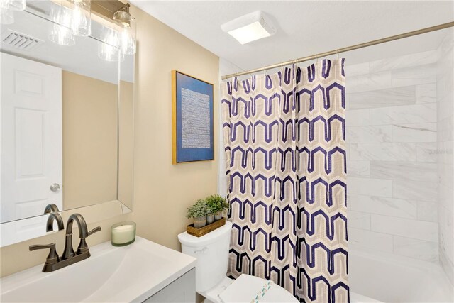 full bathroom featuring vanity, toilet, and shower / bathtub combination with curtain