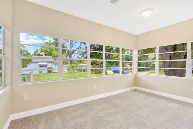 unfurnished sunroom with a wealth of natural light