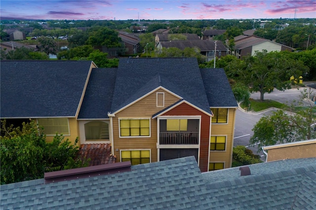 view of front of property featuring a shingled roof