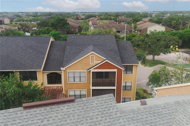 exterior space with a shingled roof