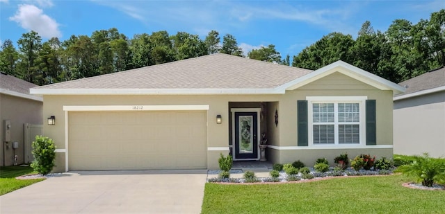 ranch-style home featuring a garage and a front yard