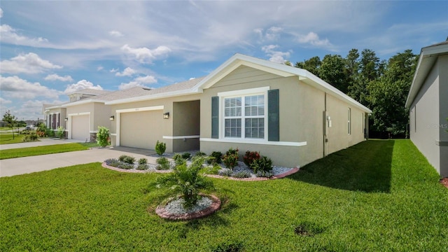 view of front of property with a garage and a front lawn