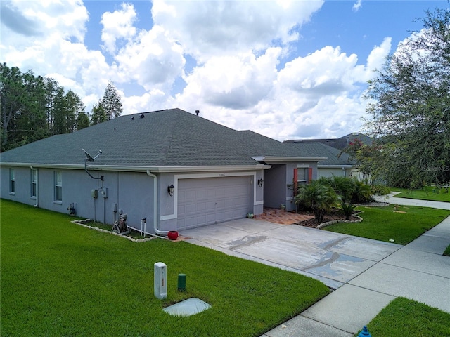 single story home with a garage and a front lawn