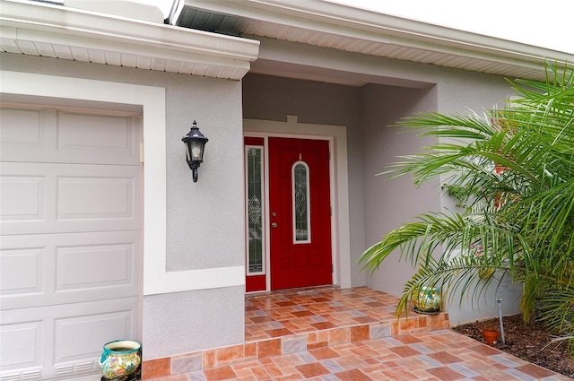 doorway to property featuring a garage