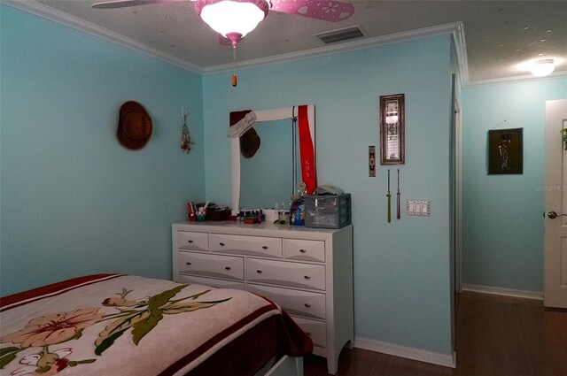 bedroom with ornamental molding, dark hardwood / wood-style floors, and ceiling fan