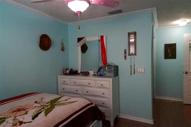 bedroom with ceiling fan, ornamental molding, and dark hardwood / wood-style flooring