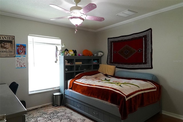 bedroom featuring ceiling fan and ornamental molding