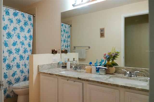 bathroom with a shower with curtain, vanity, and toilet