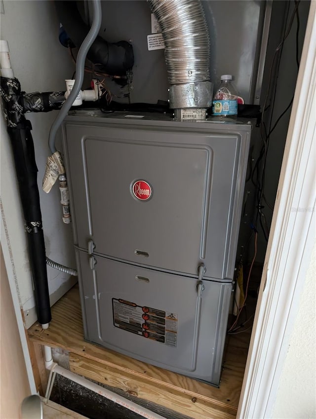 utility room featuring heating unit