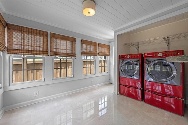 laundry room featuring crown molding, washer and dryer, and wooden ceiling