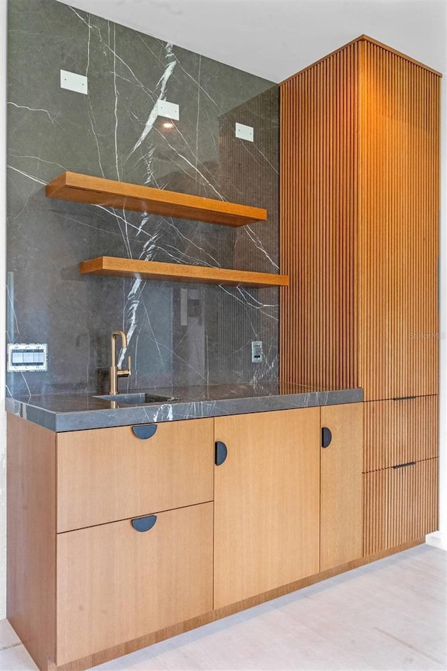 interior space featuring tasteful backsplash and sink