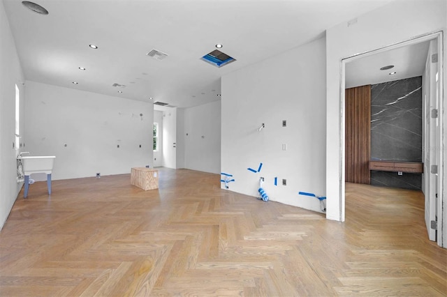 unfurnished room with light parquet floors