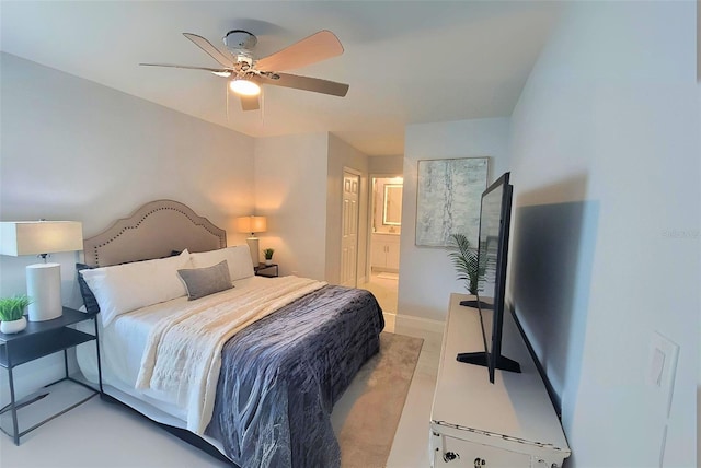 bedroom with ceiling fan and connected bathroom