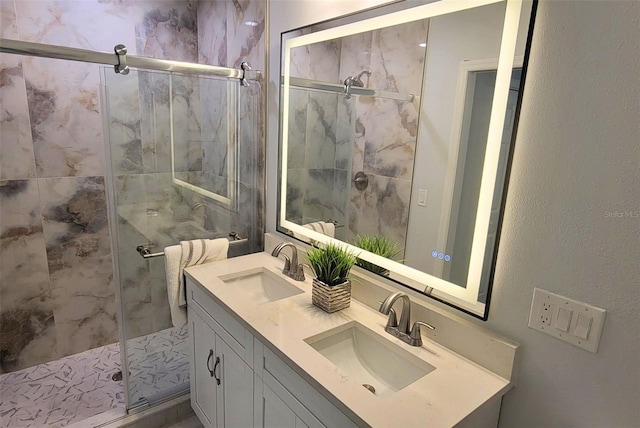 bathroom with vanity and a shower with shower door