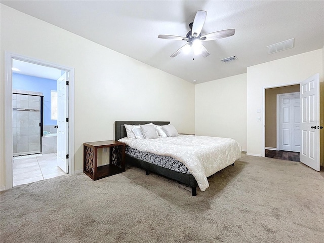 carpeted bedroom featuring ensuite bathroom and ceiling fan