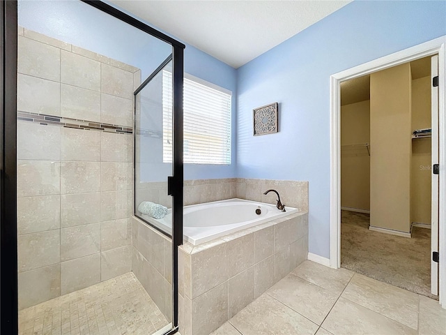 bathroom with tile patterned floors and plus walk in shower