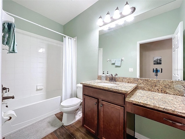 full bathroom with vanity, toilet, wood-type flooring, and shower / bath combo