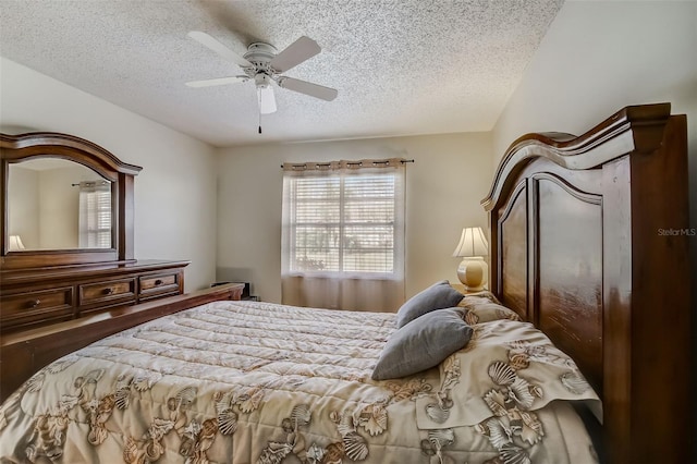 bedroom featuring wood-type flooring, a textured ceiling, and ceiling fan