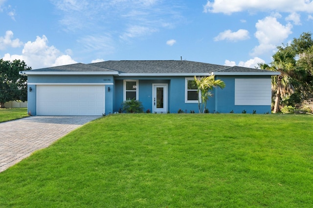 ranch-style home featuring a garage and a front yard