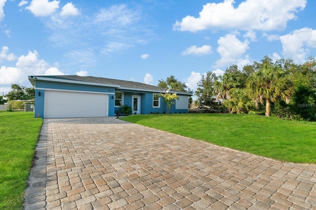 ranch-style house with central AC unit, a front yard, and a garage