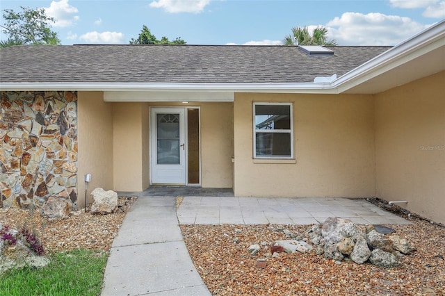 entrance to property featuring a patio area