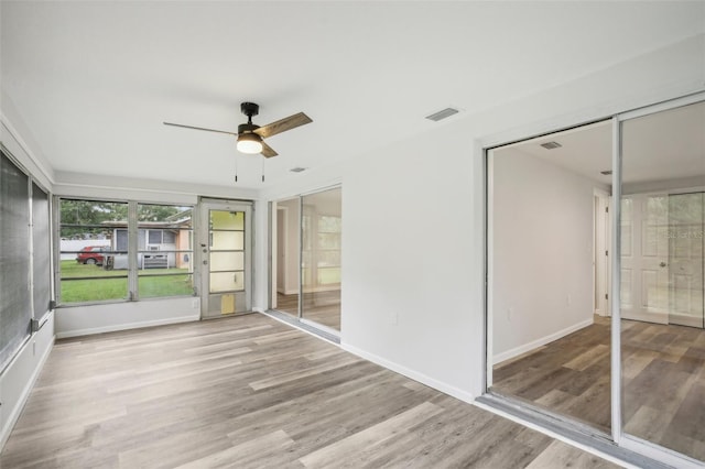 unfurnished bedroom featuring ceiling fan and hardwood / wood-style floors