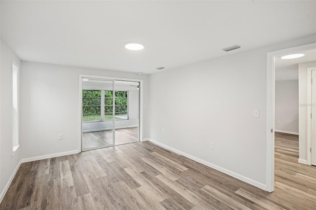 empty room featuring hardwood / wood-style floors