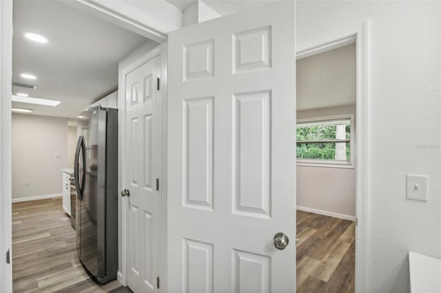 interior space featuring washing machine and dryer and wood-type flooring