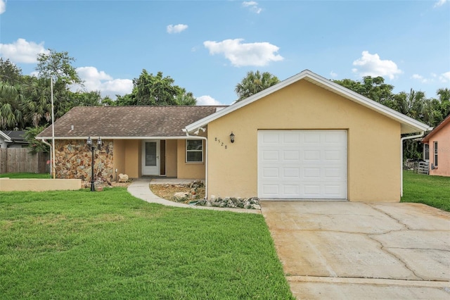 ranch-style home with a garage and a front yard