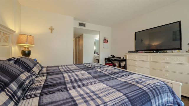 bedroom featuring a textured ceiling