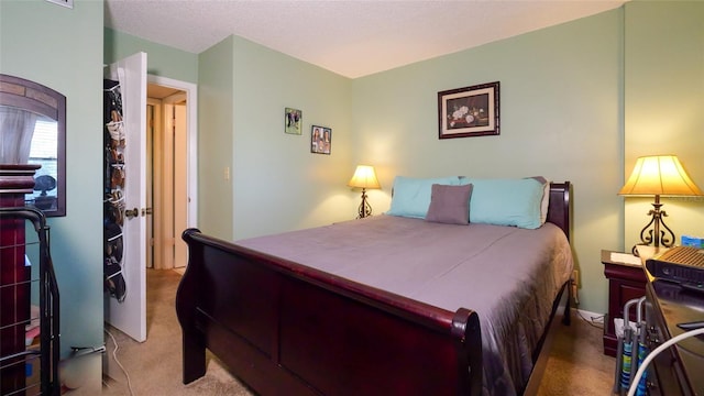 carpeted bedroom with a textured ceiling