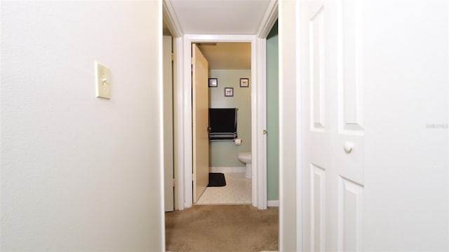 hallway with tile patterned floors