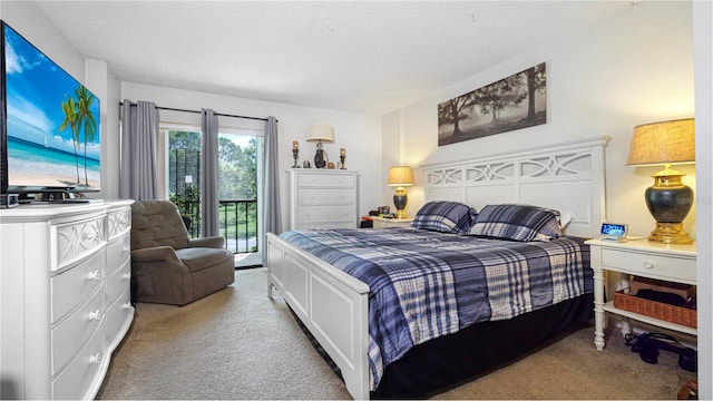 carpeted bedroom with access to outside