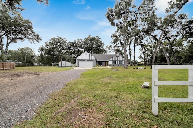 view of front of property with a front yard and a garage