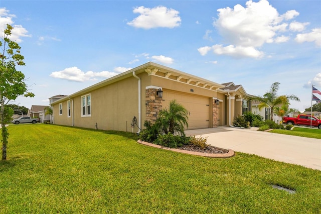 view of front of property with a garage and a front lawn