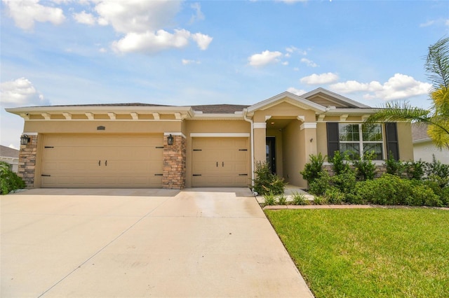 view of front of home with a garage and a front lawn