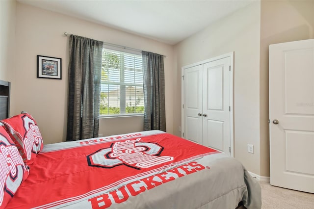 carpeted bedroom with a closet