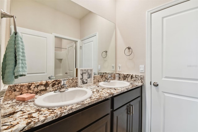 bathroom featuring dual vanity