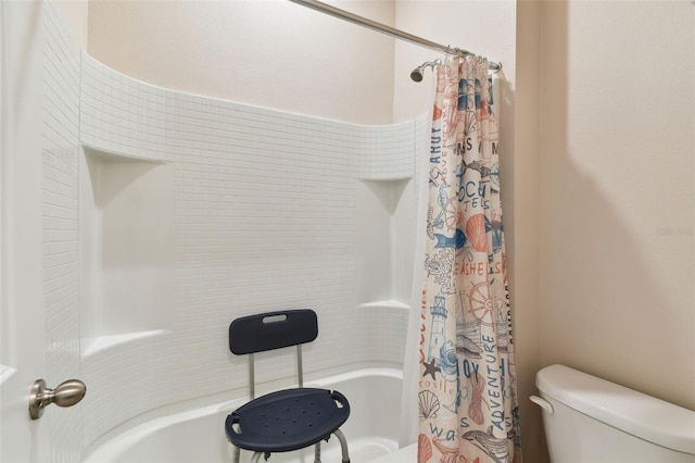 bathroom with shower / tub combo and toilet