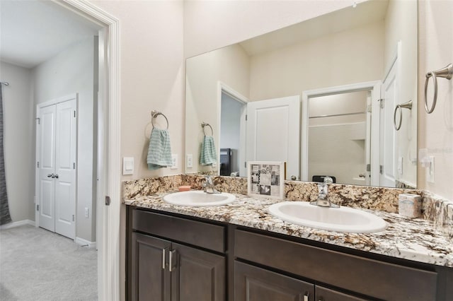 bathroom with dual vanity