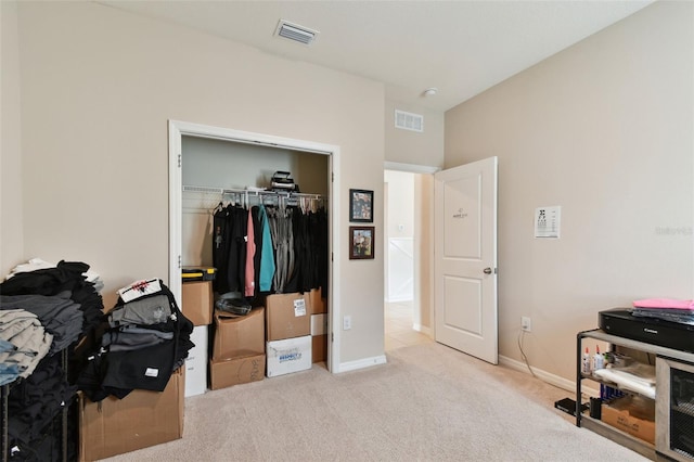 carpeted bedroom with a closet