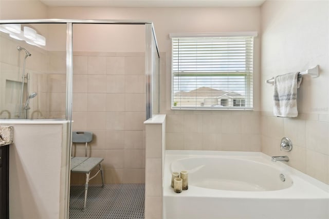 bathroom featuring plus walk in shower