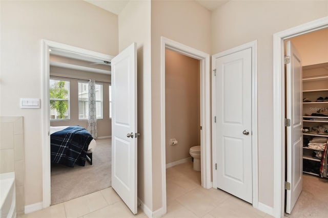 hallway with light tile patterned flooring